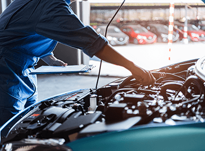 Tech working on car